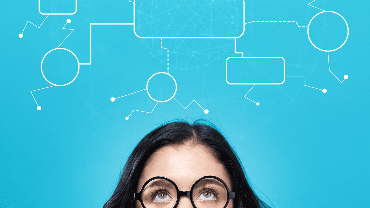 Close up of woman with glasses looking up to see a graphic of a flow chart floating above her.
