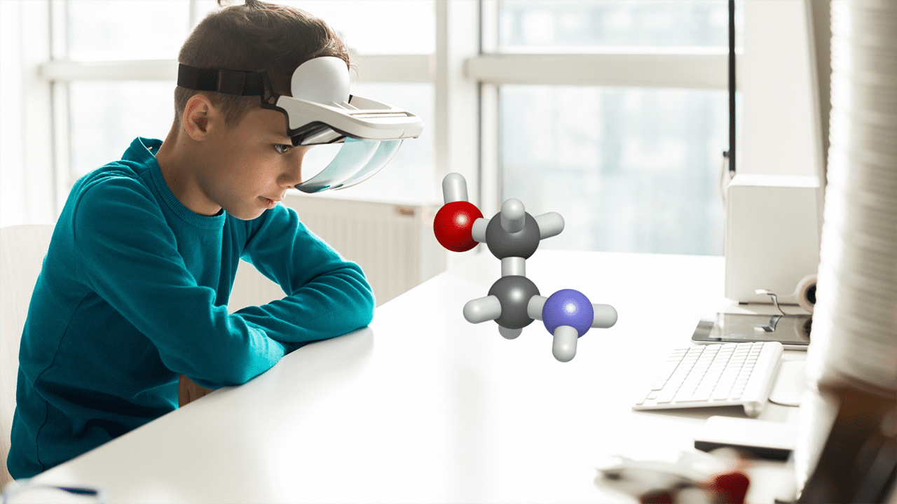 Young boy learning chemistry using Augmented Reality goggles