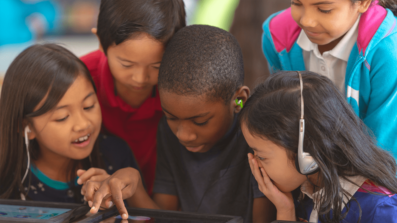 Social and Emotional Learning - children work together on tablet