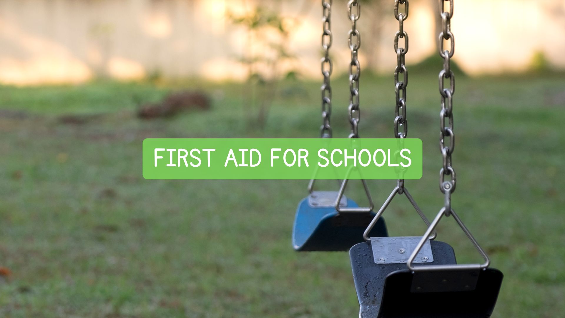 Image of playground swings with text banner: First Aid for Schools